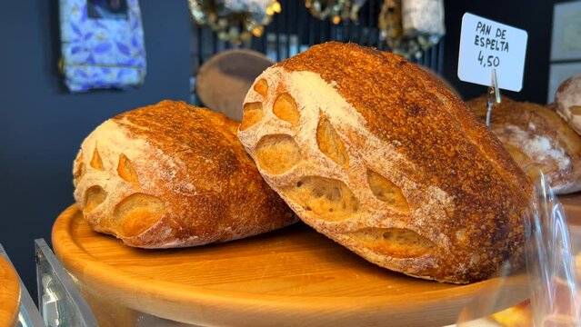 Fresh sourdough bread loafs at a bakery, golden loafs, 4K shot