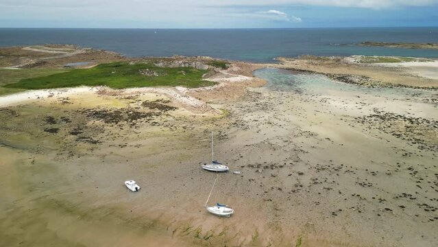 Forward Dolly Aerial of Boats Resting on Sand at Low Tide