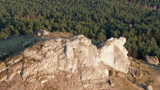 Drone close-up of rocky mountain peak with people on top, basking in nature. , Biaklo, Little Giewont, Poland, Czestochowa, Olsztyn Jurajski, polish jura, Polish Jurassic Highland
