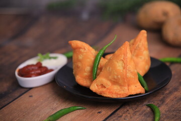 Samosa Indian famous street food snack closeup with selective focus and blur