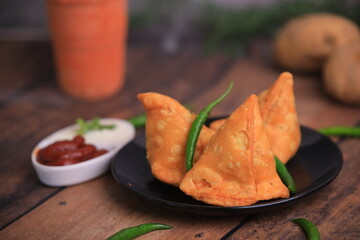 Samosa Indian famous street food snack closeup with selective focus and blur