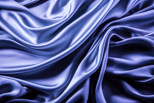 Dark indigo blue satin in wave pattern on a plain black background 