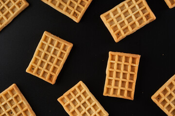 Belgian waffles isolated on black background