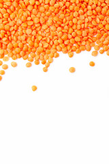 Uncooked red lentils border on white background. Copy space for text. Top view