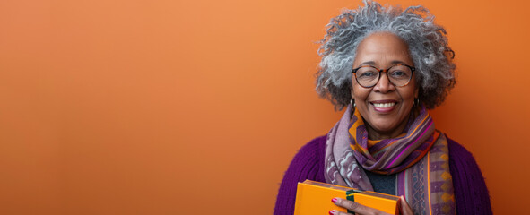 Elderly woman with gray hair and glasses holding a folder in her hands. Delivery service concept.