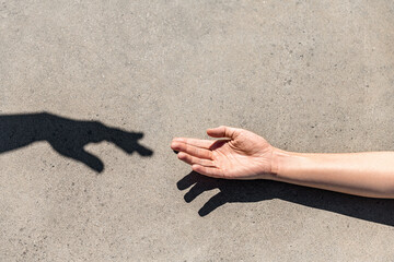 gesture, help and people concept - close up of human hand reaching to shadow - 767714701