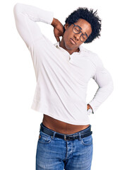 Fototapeta premium Handsome african american man with afro hair wearing casual clothes and glasses suffering of neck ache injury, touching neck with hand, muscular pain