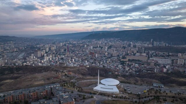 Sunset cityscape of Tbilisi city. Aerial hyperlapse