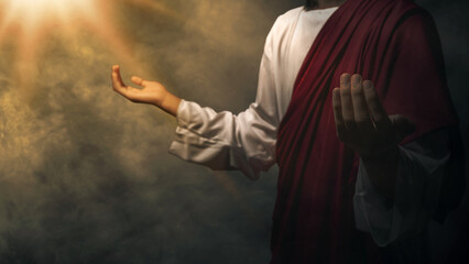 Jesus Christ's raised hands and praying to god