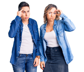 Couple of women wearing casual clothes worried and stressed about a problem with hand on forehead, nervous and anxious for crisis