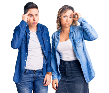 Couple of women wearing casual clothes worried and stressed about a problem with hand on forehead, nervous and anxious for crisis - Powered by Adobe