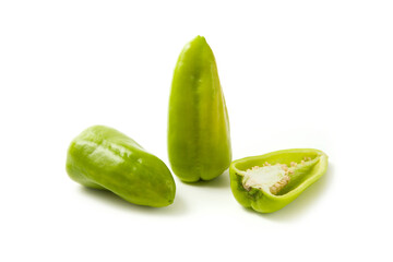 Two whole and half of green bell pepper with soft shadow isolated on white background. .
