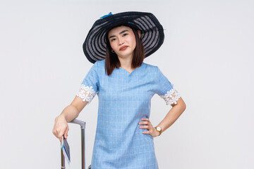 An upset and irked Asian female tourist in blue dress looking annoyed at her companion. isolated on white - obrazy, fototapety, plakaty
