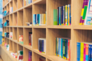 Blurry Library background off white Backdrop bright softness bookshelf with copy space. Book case Blurred background bright library silver gray lighting. defocused store light bokeh in design
