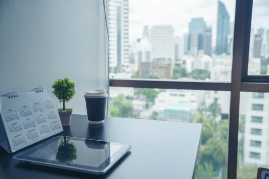 Top view office desk laptop and coffee cup on wood table copy space. Tabletop notebook laptop coffee cup for officer display empty space on wooden background. Home business work from home workspace