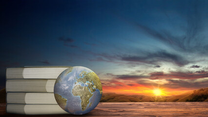 World book days concept, pile of books with the beautiful sunset landscape view as background.