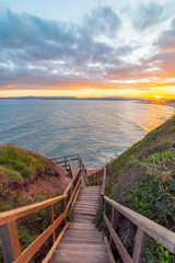 Obraz premium Stairs to Exmouth Beach from Orcombe Point at Sunset - Exmouth, Devon, UK