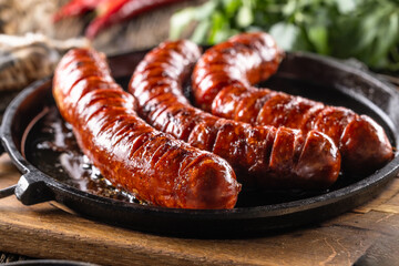 Sausages fried with spices bbq sauce and herbs - Close up - 767745743