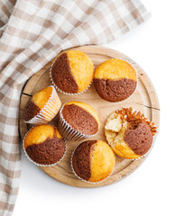 Close Up of a Muffins on cutting board isolated on white background.