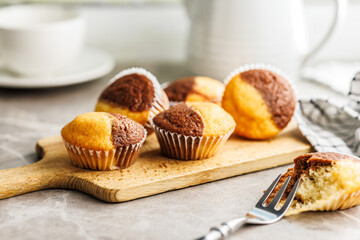 Close Up of a Muffins on cutting board on kitchen table