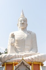 Majestic White Buddha Statue Under Clear Sky