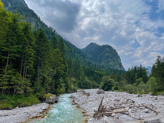 A hike through the Berchtesgaden Wimbach Tal and pass dry creek and hiking trails with deep green nature landscape