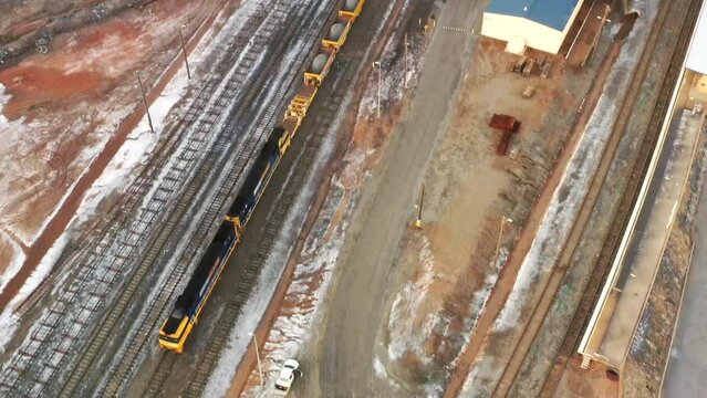 Railway freight and passenger train station in Broken Hill city of Australia as 4k aerial.
