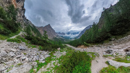 A hike through the Berchtesgaden Wimbach Tal and pass dry creek and hiking trails with deep green nature landscape