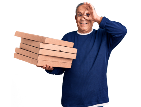 Senior handsome man holding pizza boxes smiling happy doing ok sign with hand on eye looking through fingers