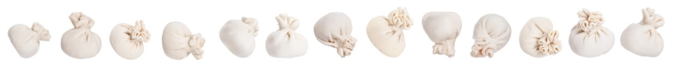 Uncooked khinkalis (dumplings) isolated on white, set