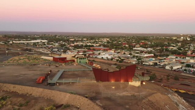 Line of Lode to Broken Hill city streets aerial sunrise panoramic hovering in Au as 4k.
