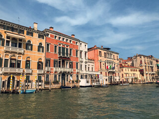 Boat ride in the Grand Canal in Venice with colorful buildings in the background