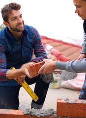 Construction, bricklayer and men build with brick, handyman or contractor with trade, mentor and...