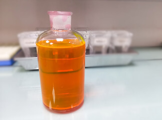 Hematoxylin and Eosin (HE) staining. Working eosin stain solution in histology laboratory with fanel and beker. laboratory equipment and glasswere.