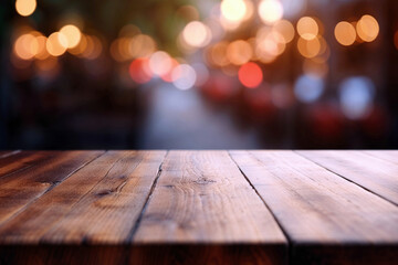 A wooden table with a blurred street cafes at night in the background. High quality photo