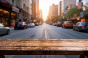 Foto op Canvas An empty wooden table with a blurred city street in the background. High quality photo © oksa_studio