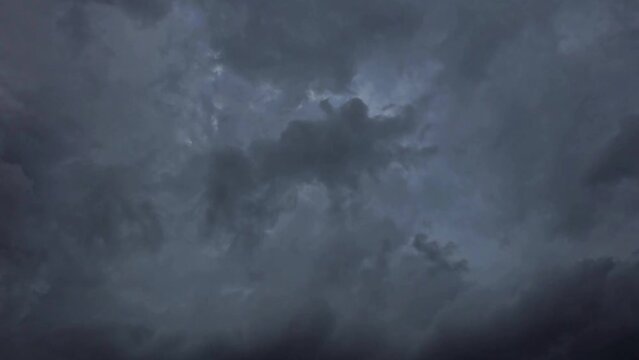Dark storm-like cloudy sky coming isolated green screen background. creepy black sky