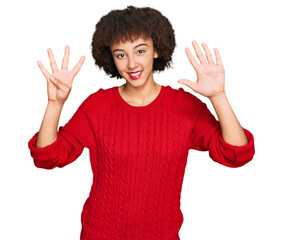 Young hispanic girl wearing casual clothes showing and pointing up with fingers number nine while smiling confident and happy.