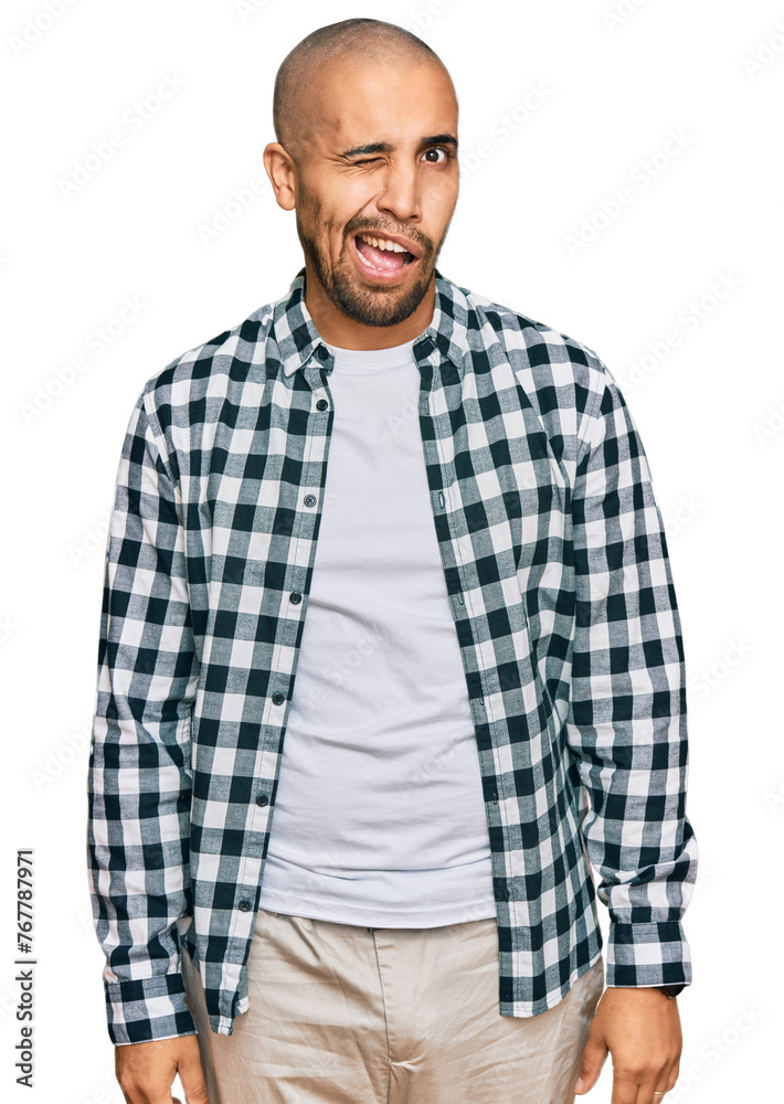 Sticker hispanic adult man wearing casual clothes winking looking at the camera with sexy expression, cheerf