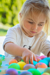 Happy Baby Coloring Easter Eggs