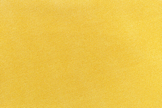 Light yellow fabric texture background, pattern of natural textile.