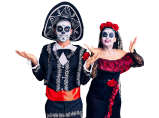 Young couple wearing mexican day of the dead costume over background celebrating crazy and amazed for success with arms raised and open eyes screaming excited. winner concept