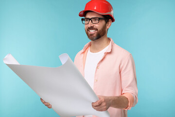 Architect in hard hat with draft on light blue background