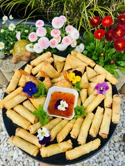 Spring rolls Homemade with edibles pansy flowers decoration