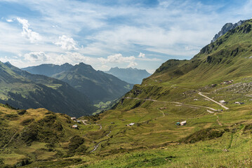 Fototapeta na wymiar Mountain landscape and pass road at Klausen Pass, Unterschaechen, Canton of Uri, Switzerland
