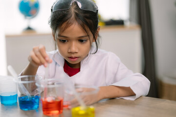 Asian girl doing chemical experiments at the lab