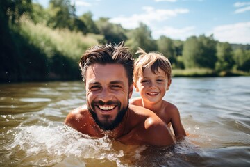 A man and a boy are in the water, smiling and enjoying themselves - obrazy, fototapety, plakaty