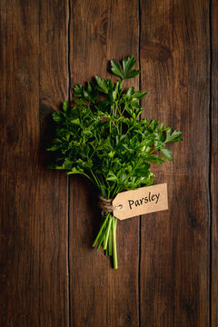 Parsley  on wooden table. Top view