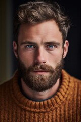 close-up male face, young pensive bearded and mustachioed man,