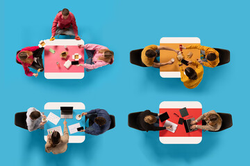 Top view of four groups of people engaged in various activities around different colored tables...